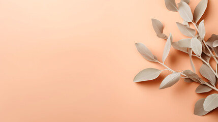 A branch of a plant on an orange background. Monochrome peach fuzz background.