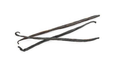 Many aromatic vanilla pods isolated on white, top view