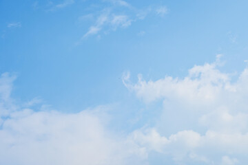 beautiful blue sky and white fluffy cloud with sunrise in the morning, natural background