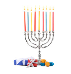 Hanukkah celebration. Menorah with candles, gift boxes and colorful dreidels isolated on white