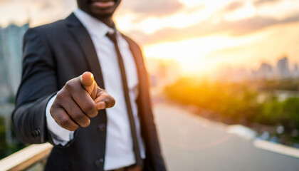 businessman pointing directly at viewer with copy space, conveying authority and direction in business communication