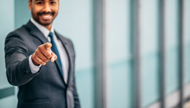 businessman pointing directly at viewer with copy space, conveying authority and direction in business communication