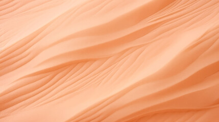 A close up view of a peach colored fabric. Monochrome peach fuzz background.