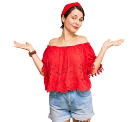 Young brunette woman with short hair wearing casual summer clothes and diadem clueless and confused...