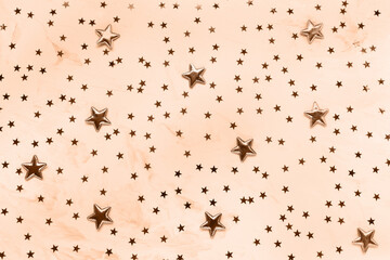 Abstract stars background, toned in trendy color of the year 2024 Peach Fuzz