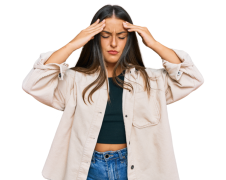 Beautiful hispanic woman wearing casual clothes suffering from headache desperate and stressed because pain and migraine. hands on head. - Powered by Adobe