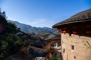 Fototapeta na wymiar Background of the roofs of the Tulou Buildings on a sunny day