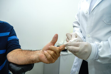 doctor performing the procedure on a diabetic patient aged between 70 and 80 years old