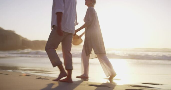Senior couple, beach walk and hand holding in sunset and married on holiday, outdoor and back. Retirement, elderly and love for commitment, bonding together and care for romantic relationship