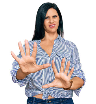 Young caucasian woman wearing casual clothes doing stop gesture with hands palms, angry and frustration expression