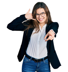 Young caucasian girl wearing business style and glasses smiling doing talking on the telephone...