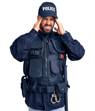 Young hispanic man wearing police uniform with hand on head, headache because stress. suffering migraine.