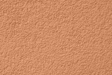 Peach Fuzz toned colour grunge decorative wall background. Art rough stylized texture banner trendy color 2024. Grunge Peach Fuzz color texture