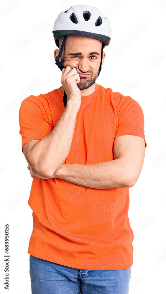 Canvas Prints young handsome man wearing bike helmet thinking looking tired and bored with depression problems wit