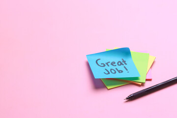Great Job written on sticky notes over pink background