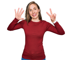 Young blonde woman wearing casual clothes showing and pointing up with fingers number seven while smiling confident and happy.
