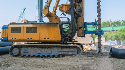 Installation for drilling wells on a crawler. Drilling holes in the ground at a construction site. Drilling equipment designed for drilling wells. Equipment for road and construction works.