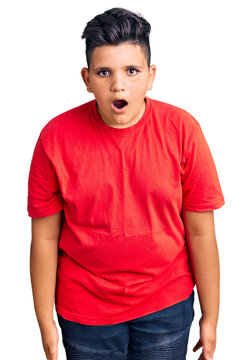 Little boy kid wearing casual clothes scared and amazed with open mouth for surprise, disbelief face