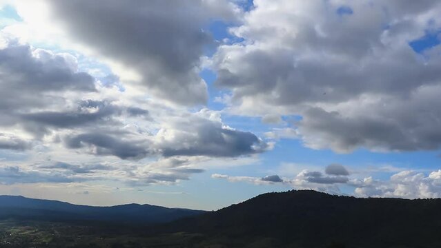 Sky and clouds moved quickly over the mountains. Time lapse video
