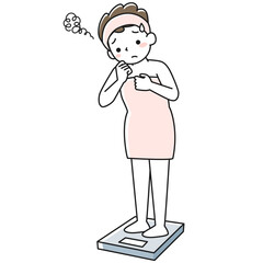 体重計に乗って憂鬱な顔をする若い女性