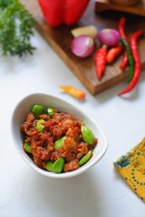 a bowl of sambal cumi petai