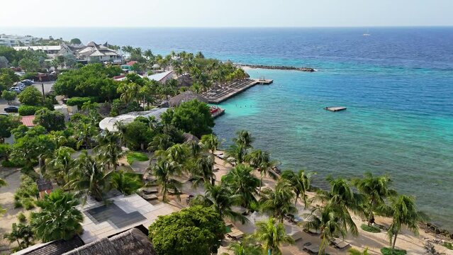 Aerial establishing view of clear turquoise Caribbean waters by Jan Thiel and Zanzibar beach, Curacao