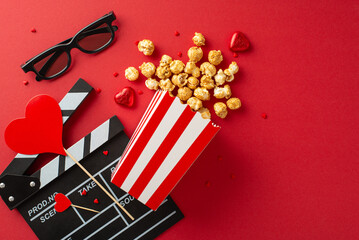 Valentine's Cinema Affair: top view of clapperboard, 3D glasses, popcorn cascading from box, sweet...
