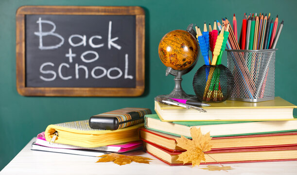 Back to school. School supplies arranged on a light background in a tabletop composition.