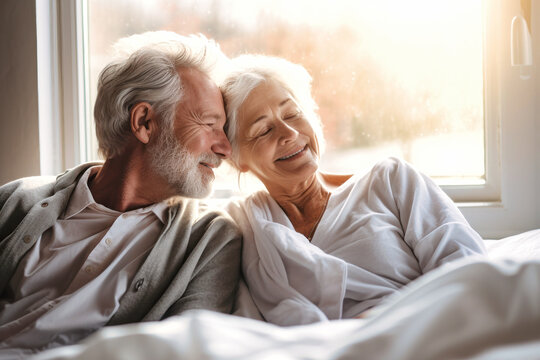 You are the beautiful part of my life. Happy elderly couple cuddling in bed. Romantic feelings. Love.