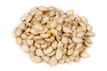 A bunch of pumpkin seeds on a white background. Lots of natural pumpkin seeds.