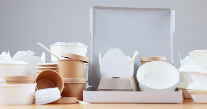 Closeup, restaurant and empty boxes for food, pizza or delivery with sustainable material on table. Paper packaging, supply chain and eco friendly container for meal, product and e commerce in cafe
