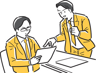 書類を見て打ち合わせをする会社員