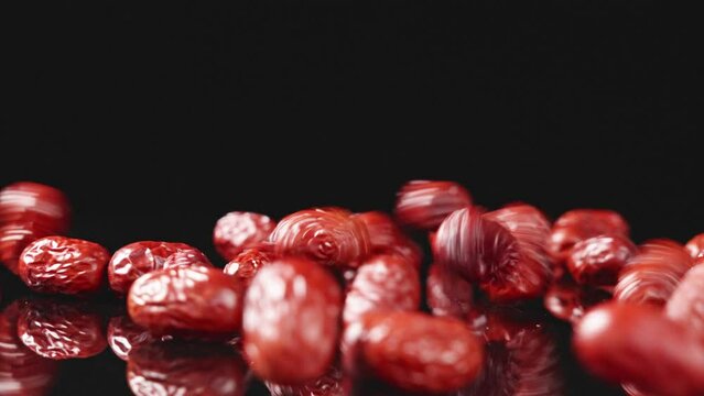 jujube,dried red dates on black background.