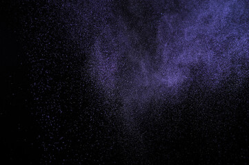 Purple explosion on black background. Light violet dust texture.