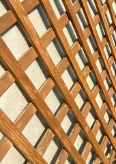 Wooden lattice on the wall as an abstract background. Texture