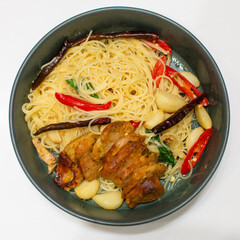 Spaghetti with Northern Thai spicy sausage on white background.