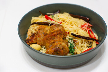 Spaghetti with Northern Thai spicy sausage on white background.