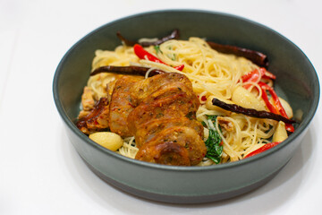 Fototapeta premium Spaghetti with Northern Thai spicy sausage on white background.