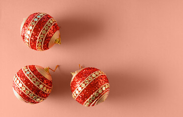 Festive Christmas balls over apricot crush color - trendy in 2024 year.