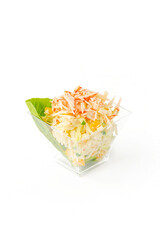 A small portion of vegetable salad on a white background