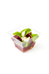 A small portion of vegetable salad on a white background