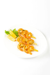 Meat snacks on a white plate on a white background