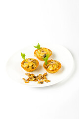 Meat snacks on a white plate on a white background