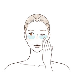 目元に保湿シートを貼る女性