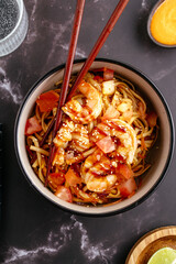 Traditional Asian noodles with vegetables, sauce and shrimp
