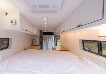 All white camper interior of a converted cargo van