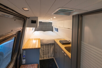 Warm inviting interior of a converted camper van