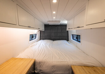 Bed room area of a converted sprinter van camper