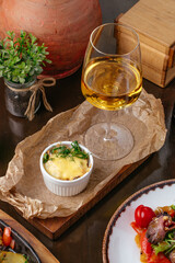 meat appetizer with a glass of wine on the table