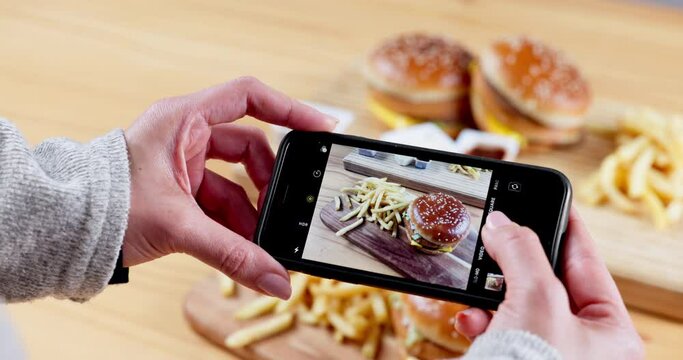 Person, hands and photography of fast food in restaurant, cafe or burger meal for snack, picture or vlog. Closeup of woman or photographer taking photographs or snaps of lunch, dinner or hamburger